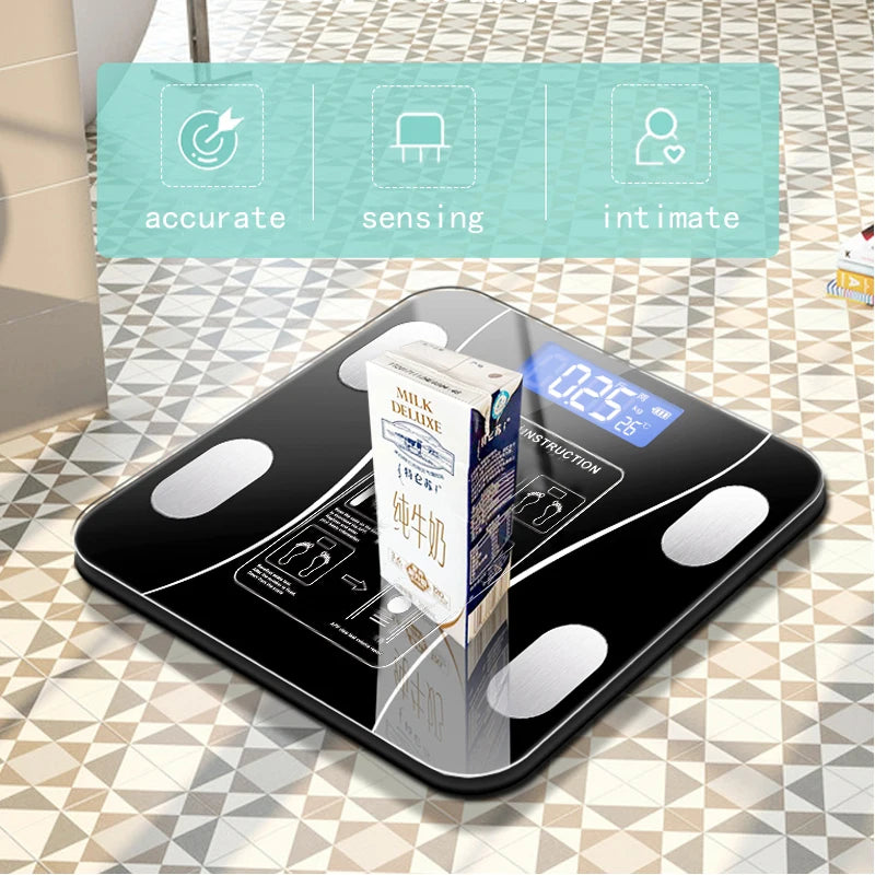 Digital kitchen scale with a carton labeled 'accurate sensing intimate' on a patterned surface.