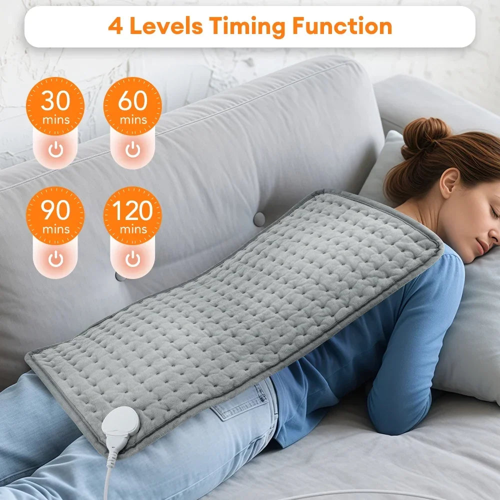 Woman using a heating pad with 4-level timing function display on a couch.