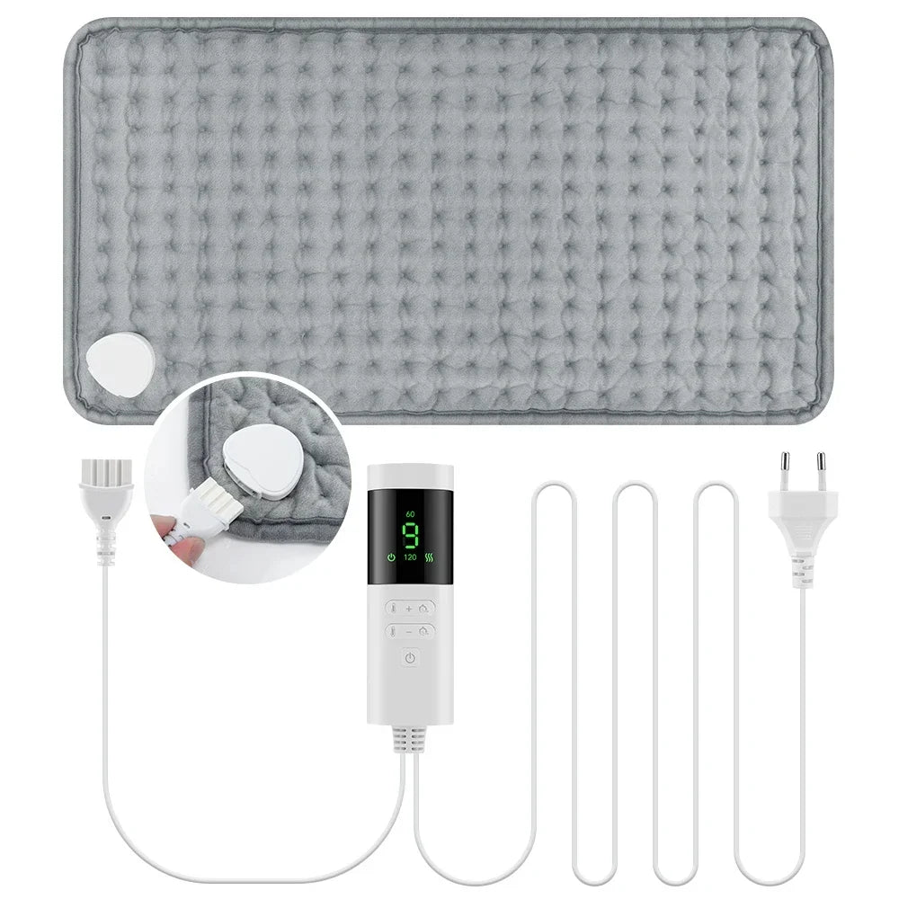 Gray heating pad with digital controller and power cord on a white background