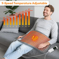 Man sitting on a couch with a 9-speed temperature adjustable heating pad, showing temperature gradient chart.