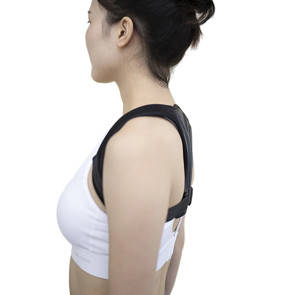 Woman wearing a black posture corrector on a white background
