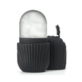 Black ribbed container with a marble-textured light inside on a white background